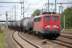 140 501-8 f�hrt mit Kesselwagenzug f�r eine l�ngere Pause im Bhf. Flughafen Berlin-Sch�nefeld ein, 02.09.10