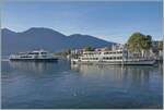 Whrend das Motoschiff  MILANO  im bei der Schiffanlegestelle von Locarno steht, nhert sich im Hintergrund ein weiteres Ausflugsschiff der Navigazione Lago Maggiore (NLM).