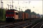 DB Schenker 155 163-9 mit Container erwischt gerade eine Wolkenlcke und die Sonne kommt zum Vorschein (Berlin Friedrichshagen, 01.07.2009)
<br><br>
Update: 10.02.2015 in Opladen verschrottet