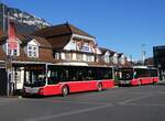 (269'912) - PostAuto Bern - BE 654'090/PID 12'339 - MAN (ex Dr. Richard, A-Wien Nr. 1419) + BE 403'166/PID 12'336 - MAN (ex Dr. Richard, A-Wien Nr. 1411) am 16. Dezember 2024 beim Bahnhof Interlaken Ost