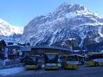 (271'315) - GrindelwaldBus, Grindelwald - Nr. 20/BE 349'361 - MAN/Gppel + Nr. 240/BE 102'240 - Mercedes + Nr. 14/BE 202'568 - MAN/Gppel am 18. Januar 2025 beim Bahnhof Grindelwald