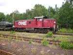 Eine MaK G 1600 der OHE wartet vor dem Bahnhof von Munster. (01.07.2009)