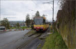 Die Strassenbahn  Be 4/8 003  alias 94 800 450 003-9 D-TVYS hat auf dem Weg nach Chavornay die Haltestelle St-Eloi verlassen. Dezember 2025.