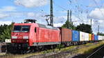 DB Cargo AG, Mainz [D] mit ihrer  145 056-8  [NVR-Nummer: 91 80 6145 056-8 D-DB], möglicherweise vermietet?? mit Containerzug am 07.07.25 Höhe Bahnhof Magdeburg-Neustadt.