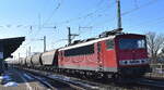LDK - Leipziger Dampf KulTour Alexander Schröter, Leipzig mit ihrer  155 191-0 
[NVR-Nummer: 91 80 6155 191-0 D-LDK] und einem Getreidezug am 18.02.25 Höhe Bahnhof Magdeburg-Neustadt.