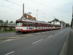 Eine Doppeltraktion aus Dsseldorfer Stadtbahnwagen GT8SU auf der Dsseldorfer Strae in Neuss als Linie U 75 zum Neusser Hbf am 30.09.2004.