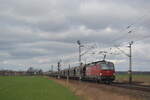 BB 1293 041 von BB mit Getreidezug in Richtung Braunschweig durch Vechelde am 17.Febraur.2023