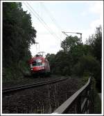 1116 005-8 mit einem Leeren Autozug in Regensburg Prfening
