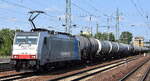 LINEAS NV/SA, Bruxelles [B] mit der geleasten Railpool Lok  186 494  [NVR-Nummer: 91 80 6186 494-1 D-Rpool] und einem Kesselwagenzug am 11.06.25 Höhe Bahnhof Schönefeld b. Berlin.