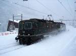 Im Schneegestber von Faido am 10.12.2008 fahren zwei BLS-Re 4/4 in den Sden.
